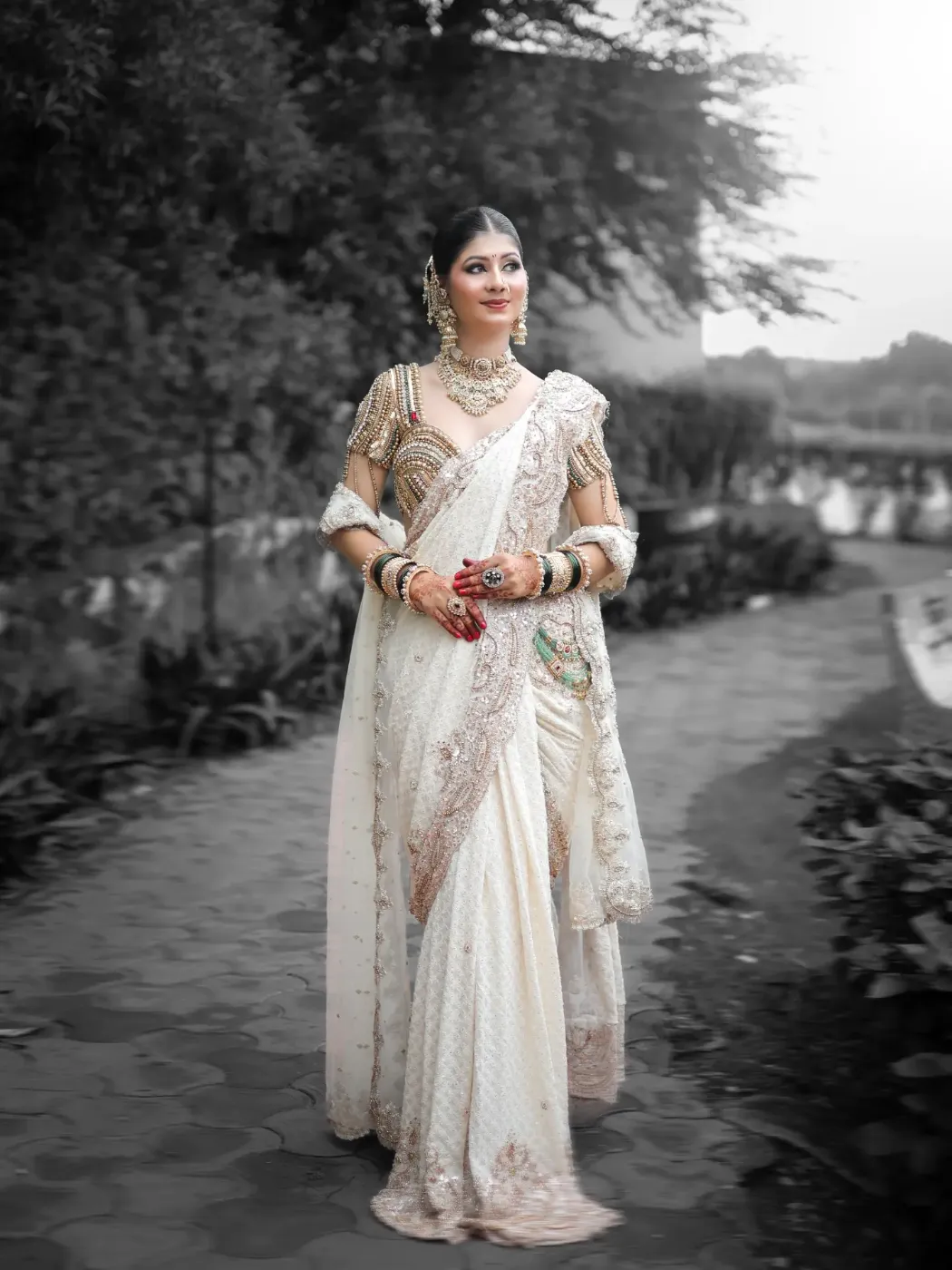 Bride outdoor portrait, ivory aur gold lehenga, black and white background